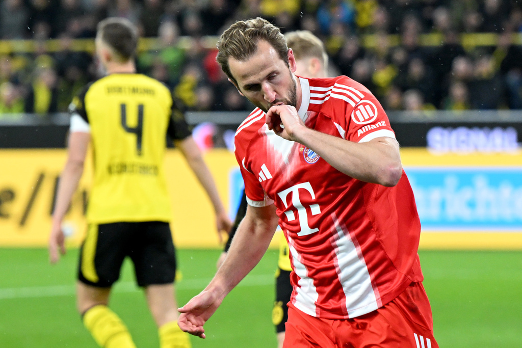 Bayern Munich's Harry Kane celebrates scoring during the Bundesliga soccer match between Borussia Dortmund and FC Bayern Munich in Dortmund, Germany, Saturday Feb. 28, 2026. (Federico Gambarini/dpa via AP)