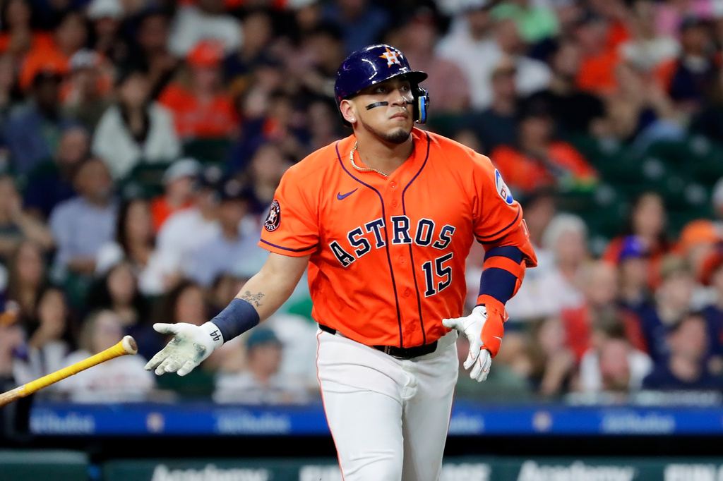 Houston Astros designated hitter Isaac Paredes flips his bat as he watches his hit against the Athletics during the third inning of a baseball game Friday, June 5, 2026, in Houston. (AP Photo/Michael Wyke)