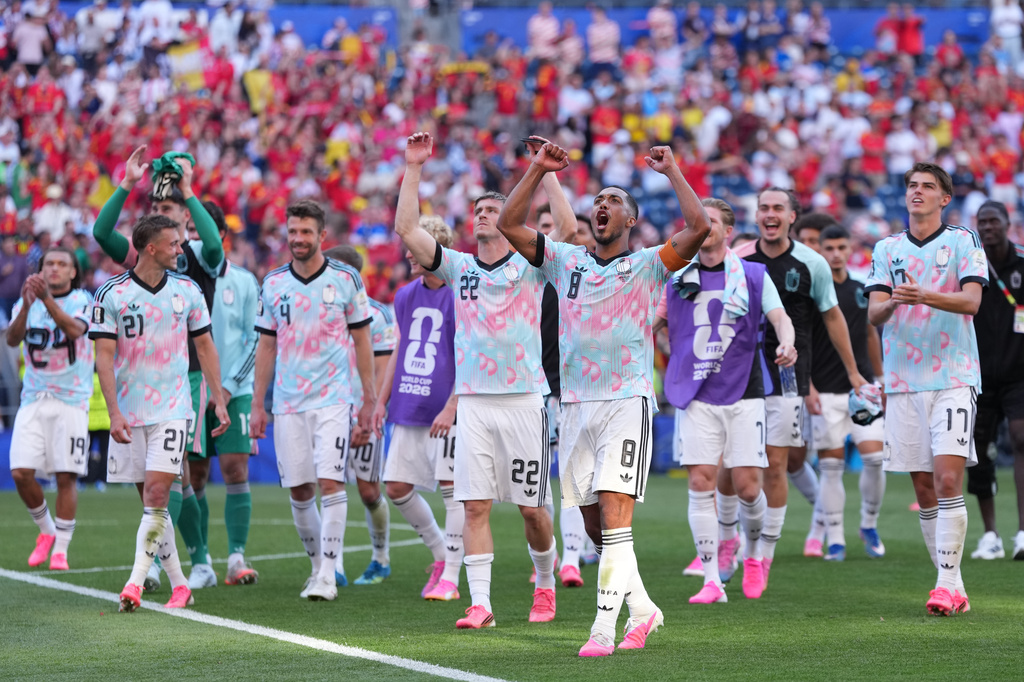 Belgium players celebrate after they won a World Cup round of 16 soccer match against the United States in Seattle, Monday, July 6, 2026. (AP Photo/Abbie Parr)