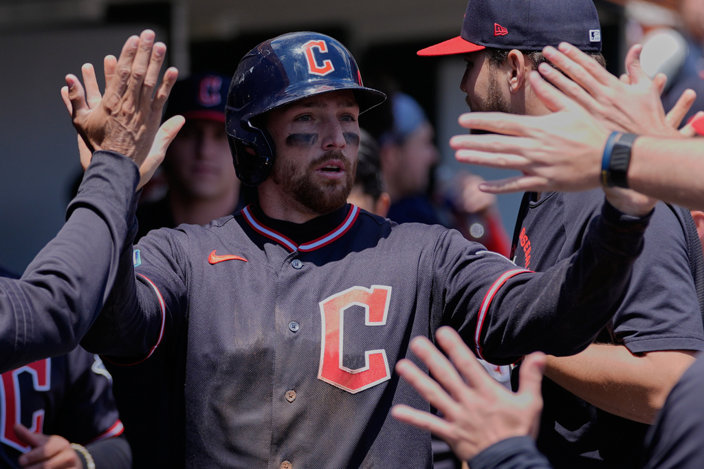 Cleveland Guardians' Daniel Schneemann celebrates after scoring against the Detroit Tigers during the third inning of a baseball game Thursday, May 21, 2026, in Detroit. (AP Photo/Paul Sancya)