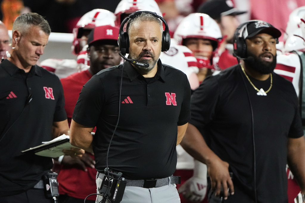 Nebraska head coach Matt Rhule, center, watches during the first half of an NCAA college football game against Cincinnati, Thursday, Aug. 28, 2025, at Arrowhead Stadium in Kansas City, Mo. (AP Photo/Charlie Riedel)