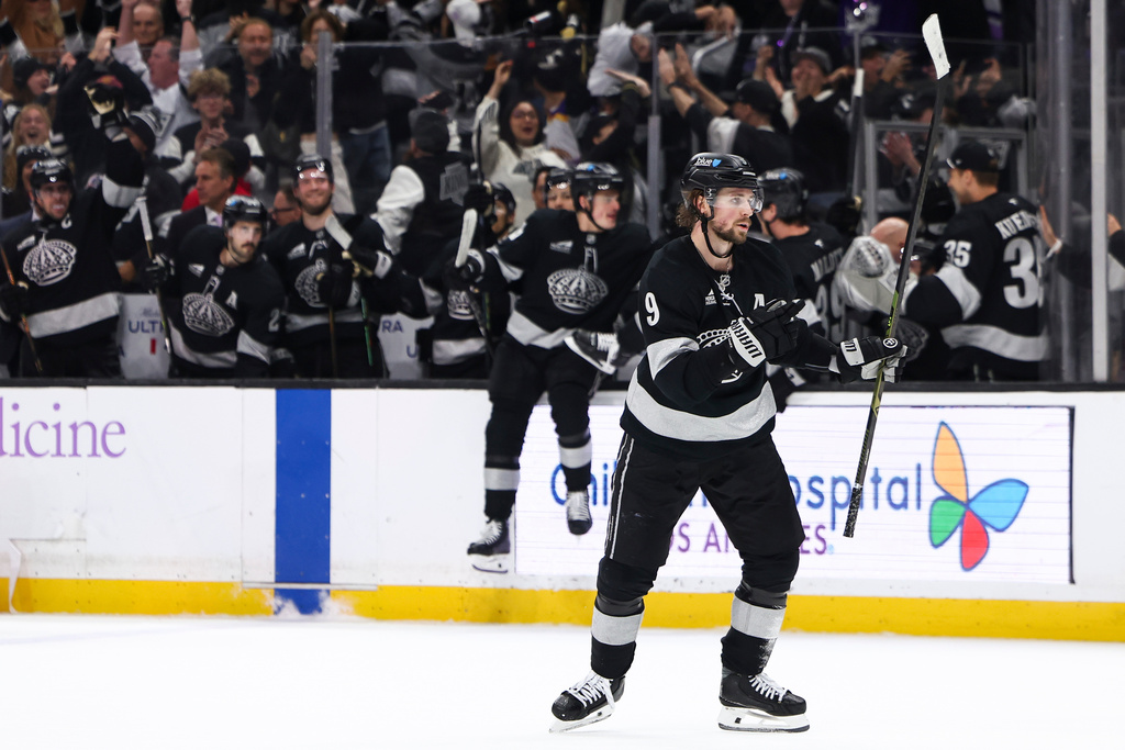 Los Angeles Kings right wing Adrian Kempe (9) celebrates after scoring the game winning goal during overtime of an NHL hockey game against the Vancouver Canucks, Saturday, Nov. 29, 2025, in Los Angeles. (AP Photo/Jessie Alcheh)