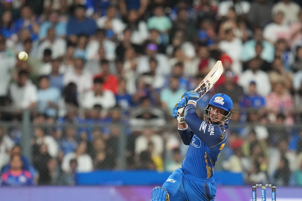 Mumbai Indians' wicketkeeper Quinton de Kock hits a boundary during the Indian Premier League cricket match between Mumbai Indians and Punjab Kings in Mumbai, India, Thursday, April 16, 2026. (AP Photo/Rafiq Maqbool)