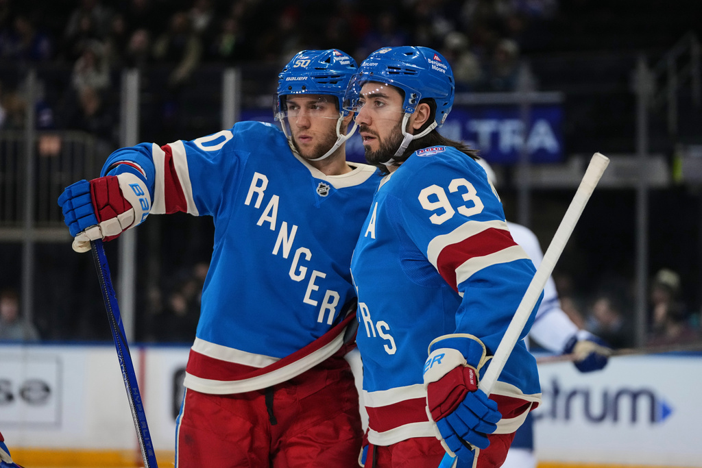 New York Rangers' Will Cuylle, left, talks with Mika Zibanejad during the first period of an NHL hockey game against the Toronto Maple Leafs Thursday, March 5, 2026, in New York. (AP Photo/Frank Franklin II)