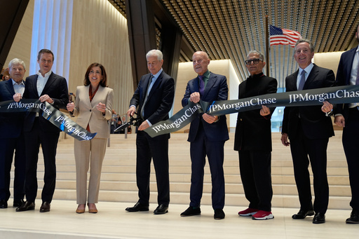 JPMorgan Chase CEO Jamie Dimon, fourth from left, cuts the ribbon on a new JPMorgan Chase building during a ceremony in New York, Tuesday, Oct. 21, 2025. Also holding the ribbon, from left to right: Jerry Speyer, Rob Speyer, NY Governor Kathy Hochul, Dimon, Norman Foster, Deepak Chopra and David Arena. (AP Photo/Seth Wenig) JPMorgan Chase CEO Jamie Dimon, fourth from left, cuts the ribbon on a new JPMorgan Chase building during a ceremony in New York, Tuesday, Oct. 21, 2025. Also holding the ribbon, from left to right: Jerry Speyer, Rob Speyer, NY Governor Kathy Hochul, Dimon, Norman Foster, Deepak Chopra and David Arena. (AP Photo/Seth Wenig)