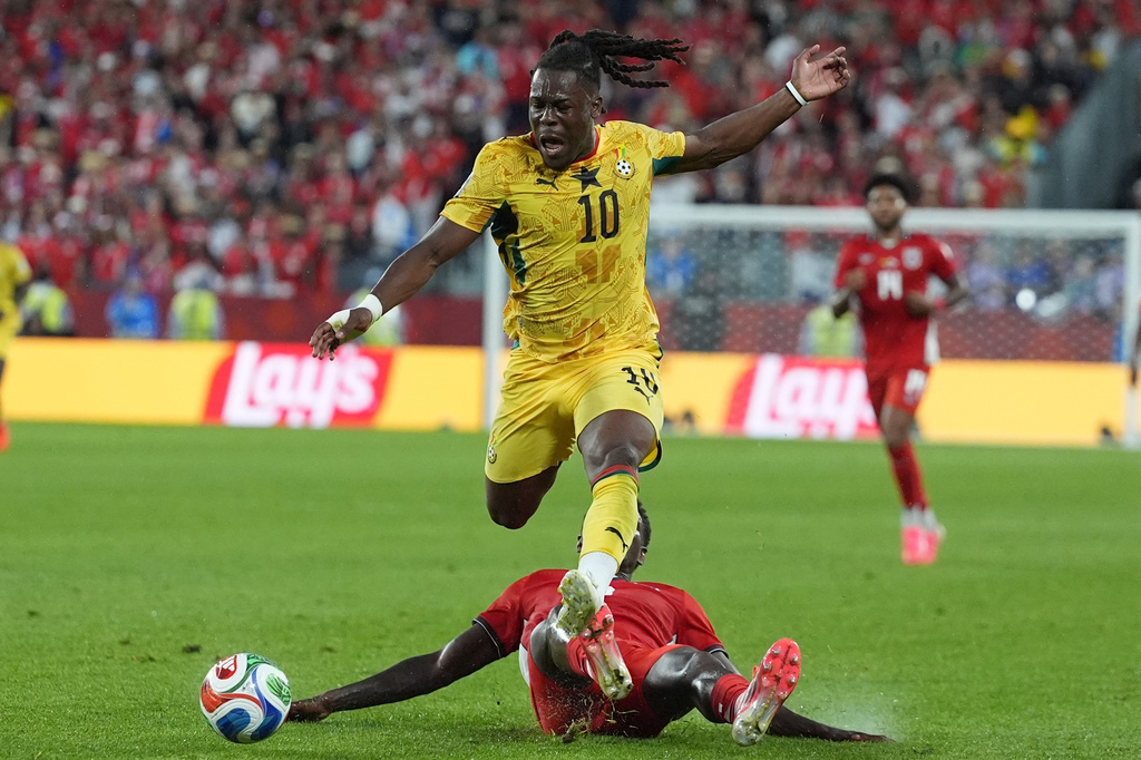 Ghana's Brandon Thomas-Asante jumps over Panama's Luis Mejia during the World Cup Group L soccer match between Ghana and Panama in Toronto, Wednesday, June 17, 2026. (AP Photo/Stephanie Scarbrough)