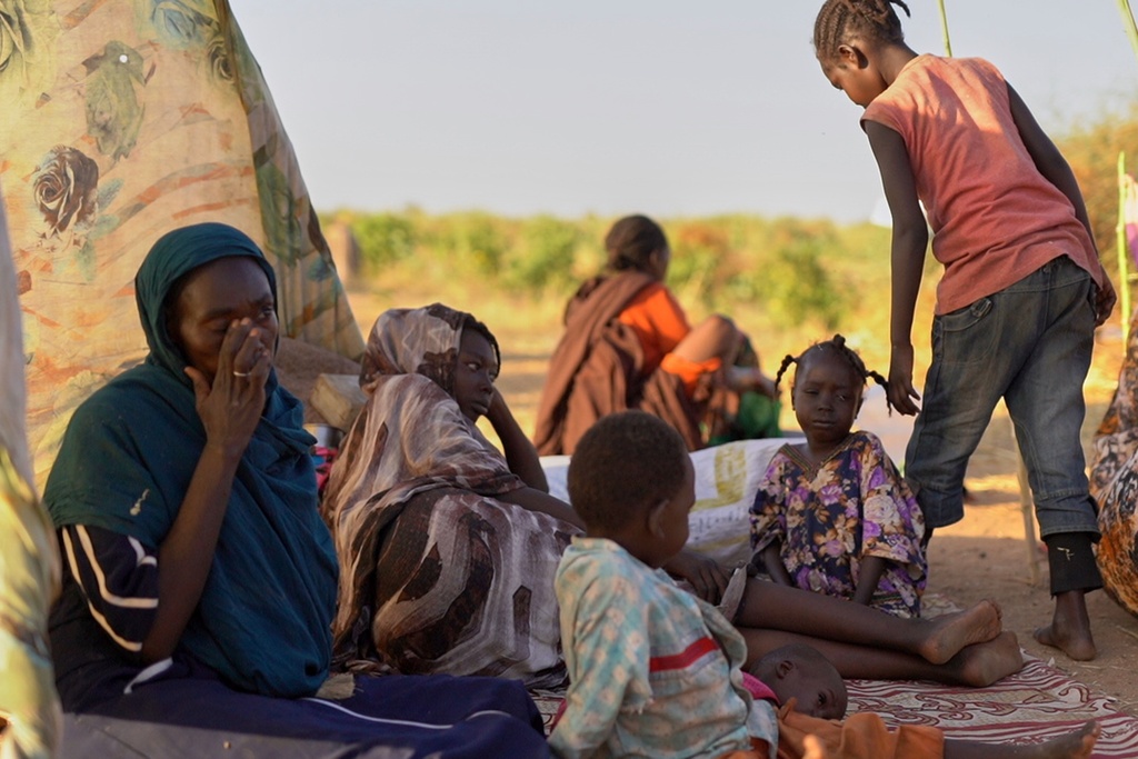This photo released by UNICEF shows displaced children and families from el-Fasher at a displacement camp where they sought refuge from fighting between government forces and the RSF, in Tawila, Darfur region, Sudan, Monday, Oct. 27, 2025. (Mohammed Jammal/UNICEF via AP)