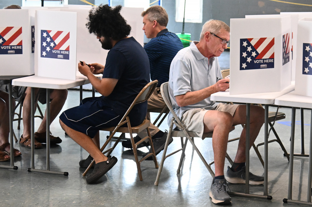 Voters cast their ballots on primary election day at Have Bible Will Travel Church on Tuesday, Aug. 4, 2026, in St. Louis. (AP Photo/Michael Thomas)