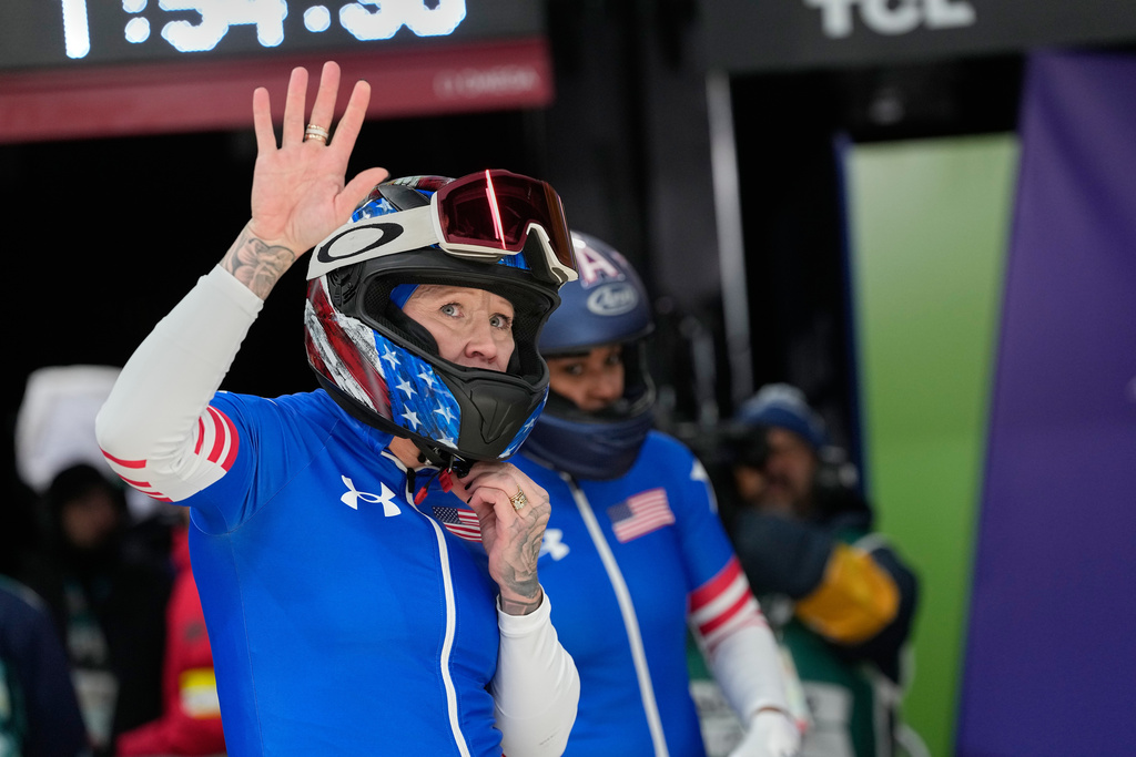 United States' Kaillie Armbruster Humphries, left, and Jasmine Jones, right, arrive at the finish during a two women bobsled run at the 2026 Winter Olympics, in Cortina d'Ampezzo, Italy, Saturday, Feb. 21, 2026. (AP Photo/Alessandra Tarantino)