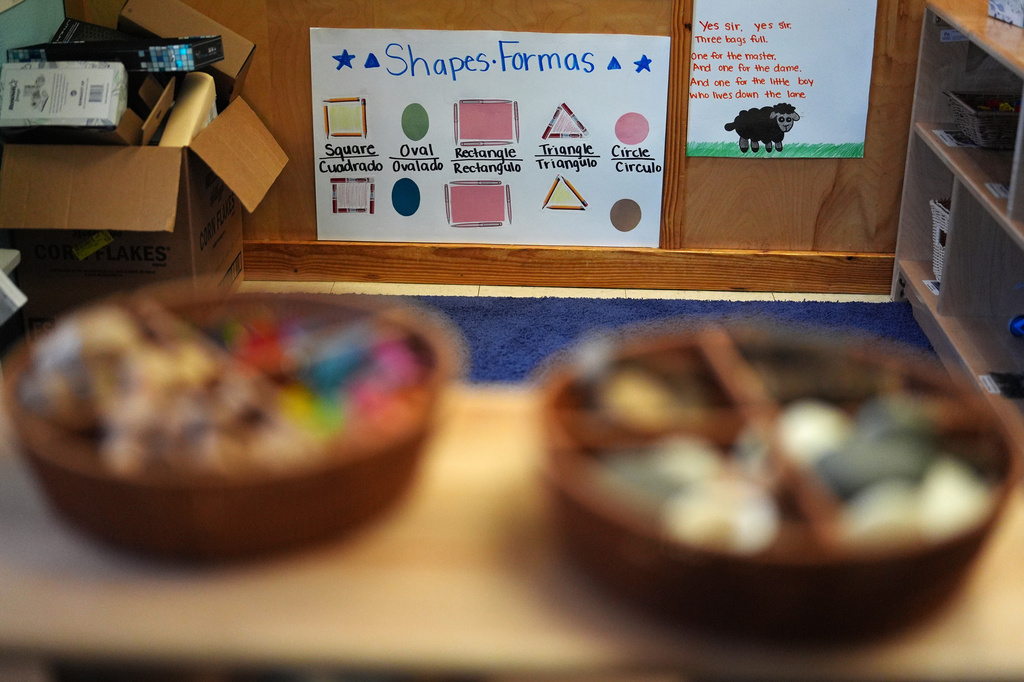 A poster shows common shapes labeled in both English and Spanish inside a classroom at a Head Start preschool in Immokalee, Fla., Thursday, Sept. 10, 2026. (AP Photo/Rebecca Blackwell)