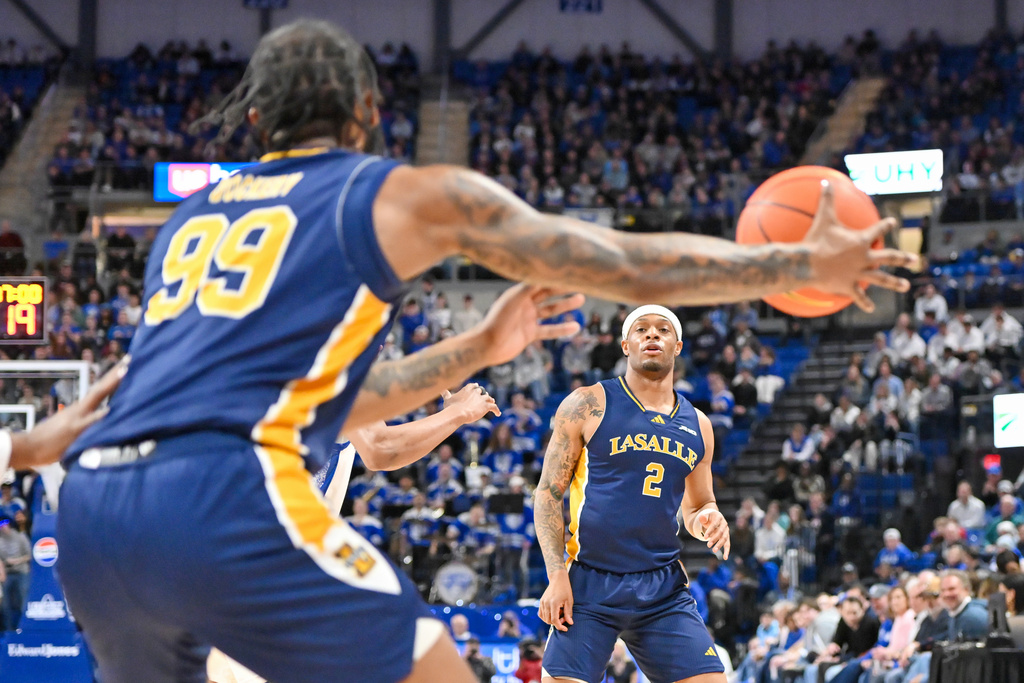 La Salle guard Jaeden Marshall (2) passes to guard Rob Dockery (99) during the first half of an NCAA college basketball game against Saint Louis, Saturday, Feb. 7, 2026, in St. Louis. (AP Photo/Ali Overstreet)