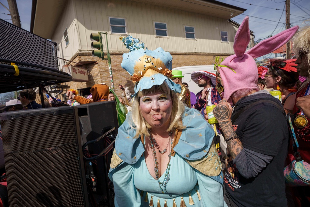 People participating in the Society of Saint Anne parade wander through the Bywater and Marigny neighborhoods on Mardi Gras Day, Tuesday, Feb. 17, 2026 in New Orleans. (AP Photo/Matthew Hinton)