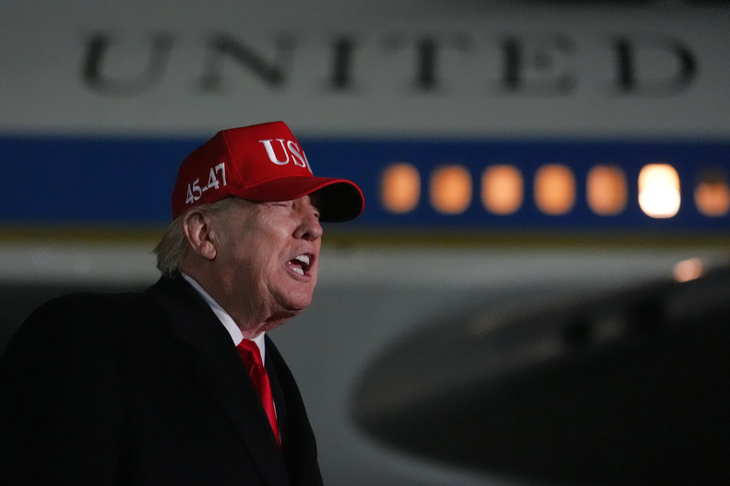 President Donald Trump speaks with reporters at Joint Base Andrews, Md., Sunday, April 12, 2026, after he returned from Miami. (AP Photo/Julia Demaree Nikhinson)