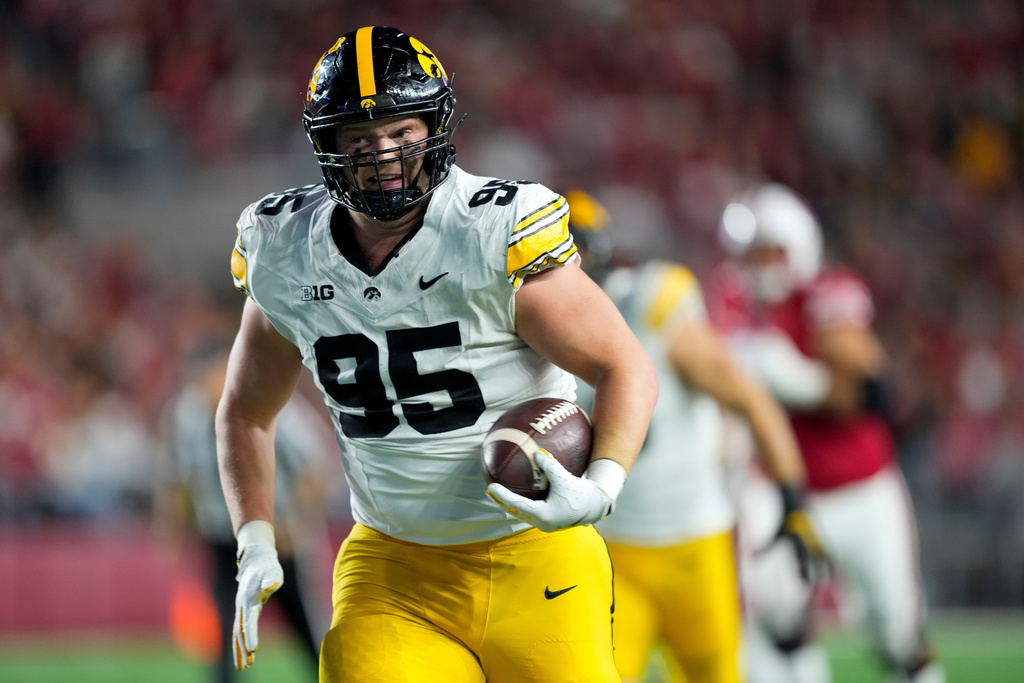 Iowa defensive lineman Aaron Graves (95) runs against Wisconsin on a turnover during the first half of an NCAA college football game Saturday, Oct. 11, 2025, in Madison, Wis. (AP Photo/Andy Manis)