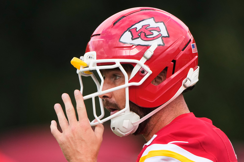 Kansas City Chiefs tight end Travis Kelce talks with a teammate during NFL football training camp Saturday, Aug. 1, 2026, in St. Joseph, Mo. (AP Photo/Charlie Riedel)