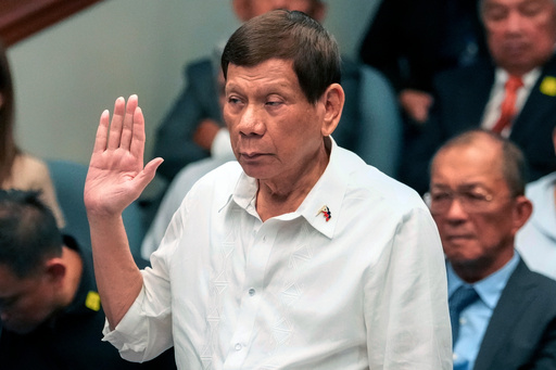 FILE - Former Philippine President Rodrigo Duterte takes oath during a senate inquiry on the so-called war on drugs during his administration at the Philippine Senate, on Oct. 28, 2024, in Manila, Philippines. (AP Photo/Aaron Favila, File) FILE - Former Philippine President Rodrigo Duterte takes oath during a senate inquiry on the so-called war on drugs during his administration at the Philippine Senate, on Oct. 28, 2024, in Manila, Philippines. (AP Photo/Aaron Favila, File)