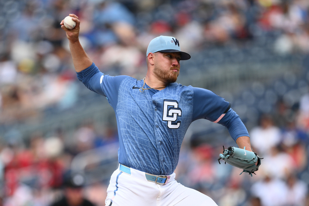 Washington Nationals pitcher Cade Cavalli throws during the third inning of a baseball game against the Seattle Mariners, Saturday, June 13, 2026, in Washington. (AP Photo/Nick Wass)