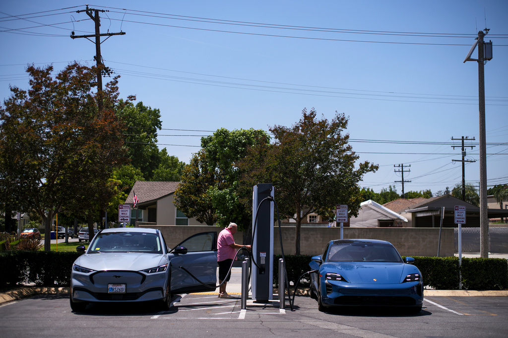 FILE - Electric vehicles charge at an Electrify America station in Arcadia, Calif., May 22, 2025. (AP Photo/Jae C. Hong, File)