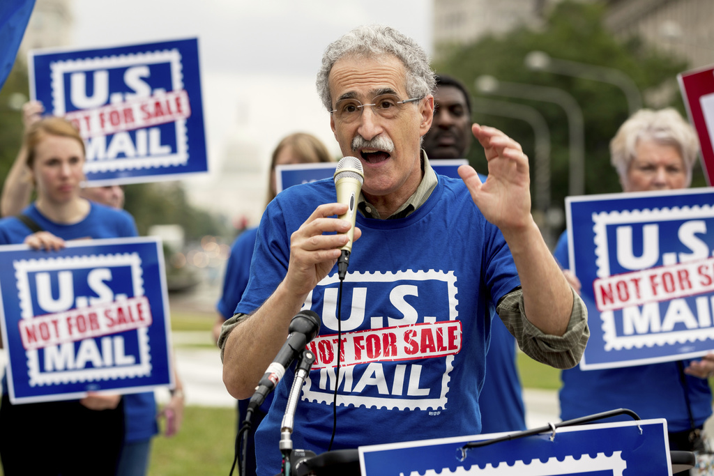 FILE - American Postal Workers Union President Mark Dimondstein speaks at a rally, Oct. 8, 2018, in Washington. (AP Photo/Andrew Harnik)