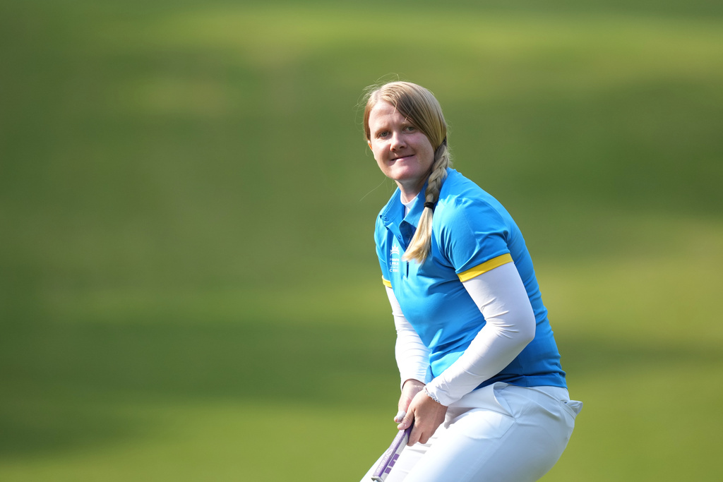 Ingrid Lindblad of Sweden reacts after making a putt on the first hole during the pool B match against team South Korea for the LPGA International Crown golf tournament at the New Korea Country Club in Goyang, South Korea, Thursday, Oct. 23, 2025. (AP Photo/Lee Jin-man)