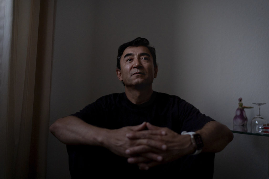 Former Xinjiang government engineer Nureli Abliz, sits for a portrait in Mannheim, Germany, where he now lives in exile, Wednesday, July 23, 2025. (AP Photo/David Goldman)
