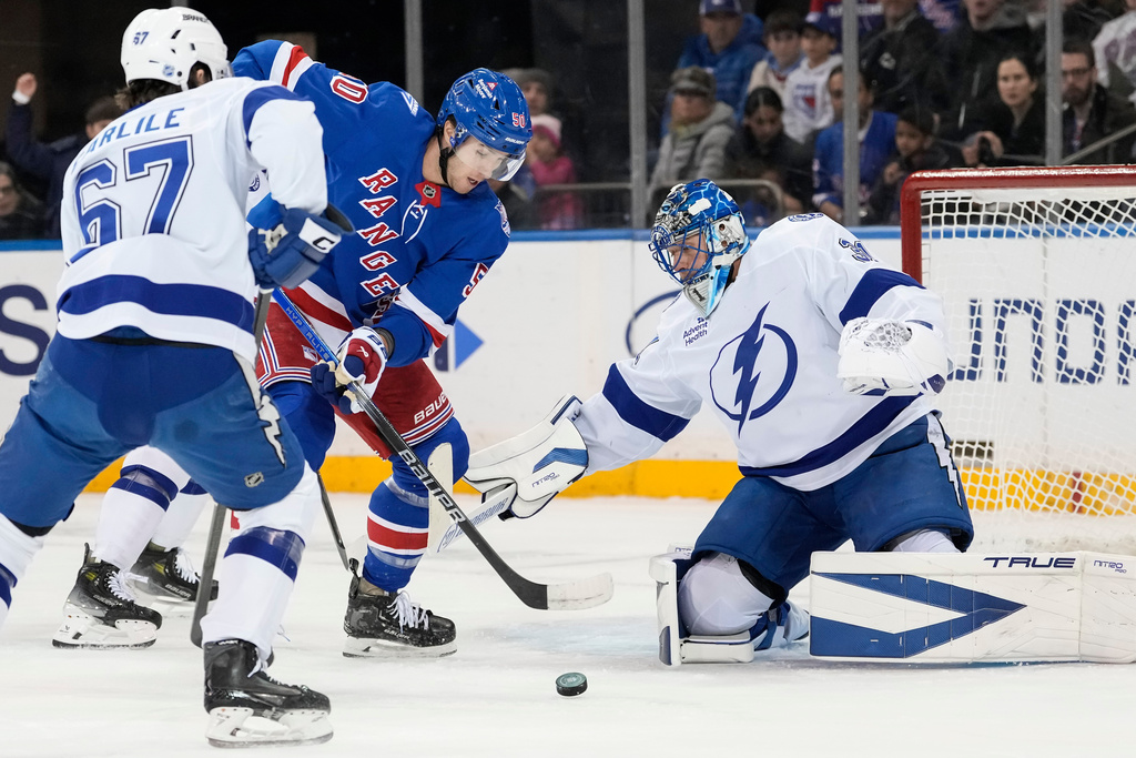 New York Rangers left wing Will Cuylle (50) shoots the puck during the first period of an NHL hockey game against Tampa Bay Lightning, Saturday, Nov. 29, 2025, in New York. (AP Photo/Yuki Iwamura)