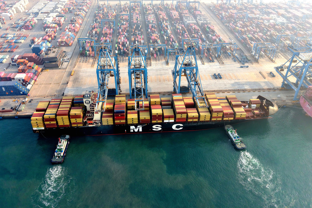 A container ship docks at a terminal in Qingdao in eastern China's Shandong province, on Nov. 30, 2025. (Chinatopix via AP)