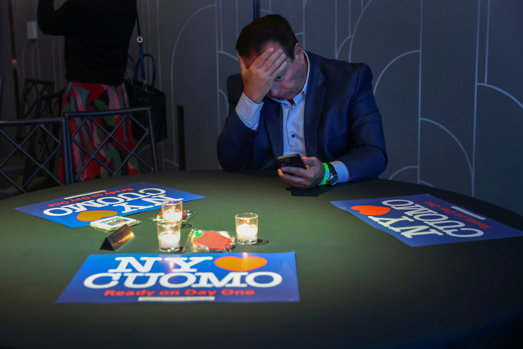 A supporter for independent mayoral candidate Andrew Cuomo watches election night returns during a watch party for Cuomo, Tuesday, Nov. 4, 2025, in New York. (AP Photo/Heather Khalifa)