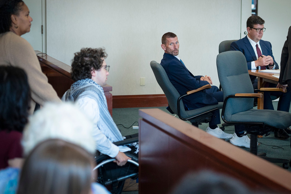 Jason Eaton watches as Hisham Awartani arrives to testify in Eaton's trial in Burlington, Vt., Monday, Sept. 14, 2026. (Glenn Russell/Pool photo via AP)