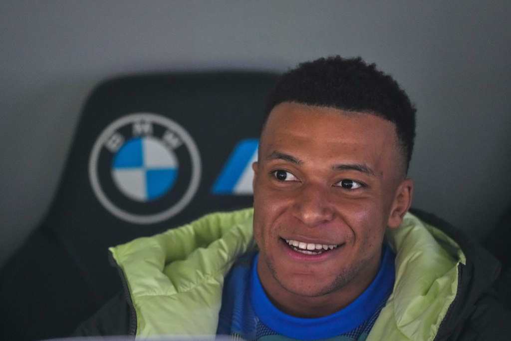 Real Madrid's Kylian Mbappe sits on the bench prior to the Spanish La Liga soccer match between Real Madrid and Real Sociedad in Madrid, Spain, Saturday, Feb. 14, 2026. (AP Photo/Manu Fernandez)