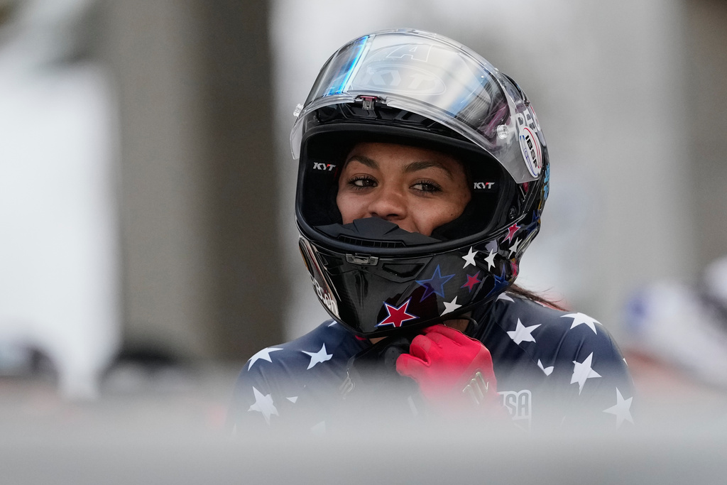 FILE - Winner Kaysha Love of the United States celebrates after the women's monobob race at the Bobsleigh World Cup in Innsbruck, Austria, Saturday, Nov. 29, 2025. (AP Photo/Matthias Schrader, File)