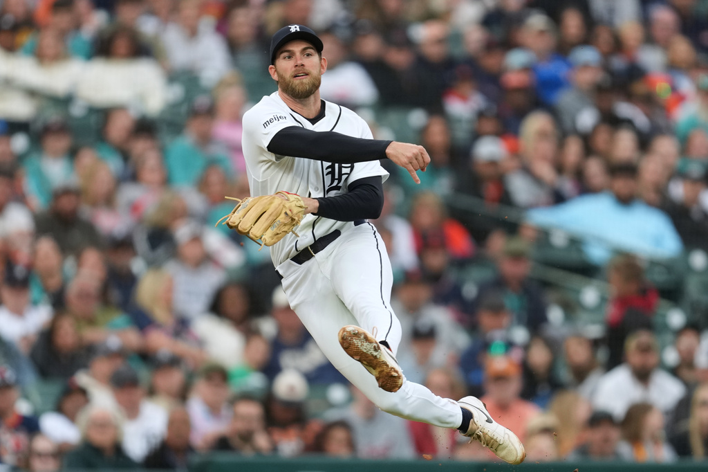 Detroit Tigers third baseman Gage Workman throws to first base against the Cleveland Guardians during the sixth inning of a baseball game Wednesday, May 20, 2026, in Detroit. (AP Photo/Paul Sancya)