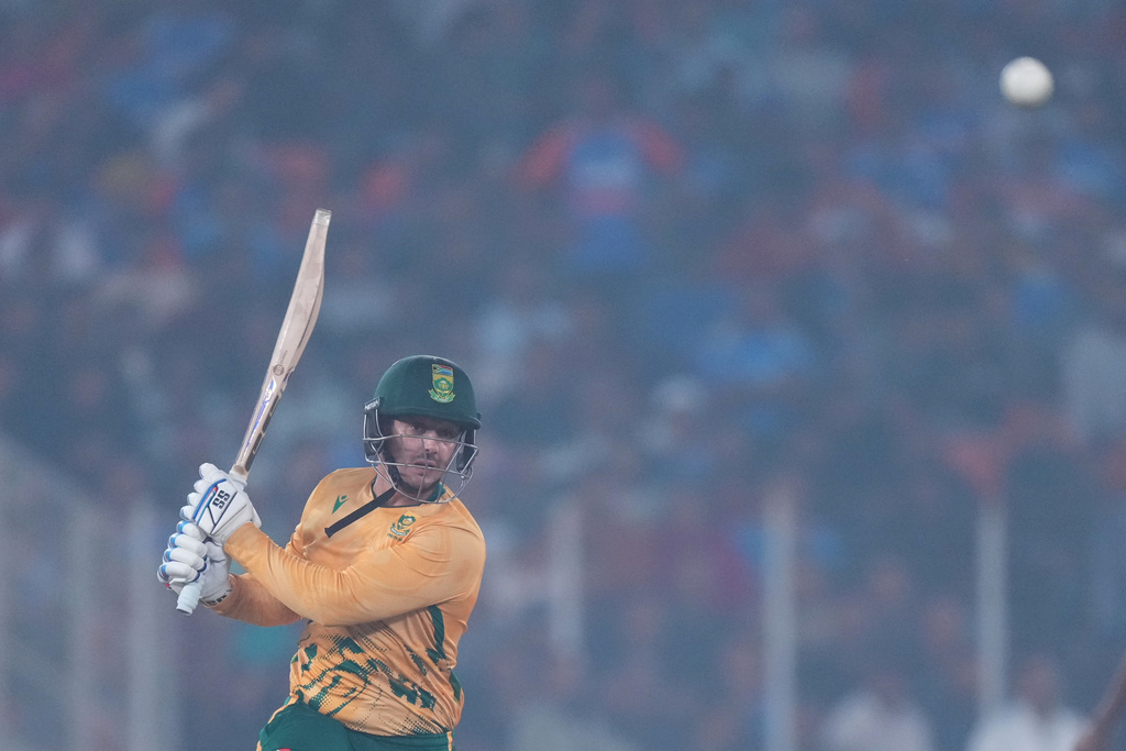 South Africa's Quinton de Kock plays a shot during the fifth T20 cricket match between India and South Africa in Ahmedabad, India, Friday, Dec. 19, 2025. (AP Photo/Ajit Solanki)