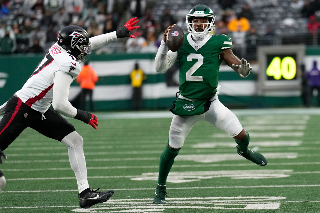New York Jets quarterback Tyrod Taylor (2) runs against Atlanta Falcons linebacker Arnold Ebiketie (17) during the second half of an NFL football game, Sunday, Nov. 30, 2025, in East Rutherford, N.J. (AP Photo/Seth Wenig)
