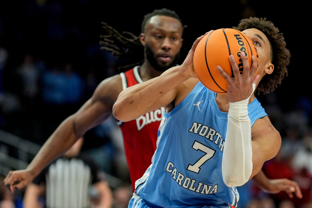 North Carolina guard Seth Trimble (7) shoots against Ohio State during the second half of an NCAA basketball game, Saturday, Dec. 20, 2025, in Atlanta. (AP Photo/Mike Stewart)