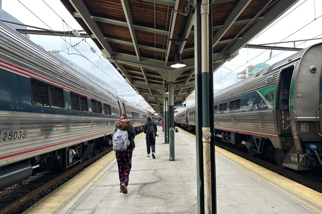FILE - People walk through Union Station on March 27, 2026, in Washington. (AP Photo/Bill Barrow, File)