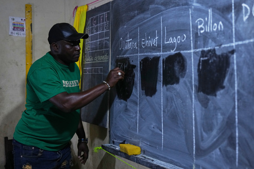 An election official records poll result on a chalkboard at a polling station in the Yopougon suburb of Abidjan, Ivory Coast, Saturday, Oct. 25, 2025, as polls close during the presidential elections. (AP Photo/Misper Apawu) An election official records poll result on a chalkboard at a polling station in the Yopougon suburb of Abidjan, Ivory Coast, Saturday, Oct. 25, 2025, as polls close during the presidential elections. (AP Photo/Misper Apawu)