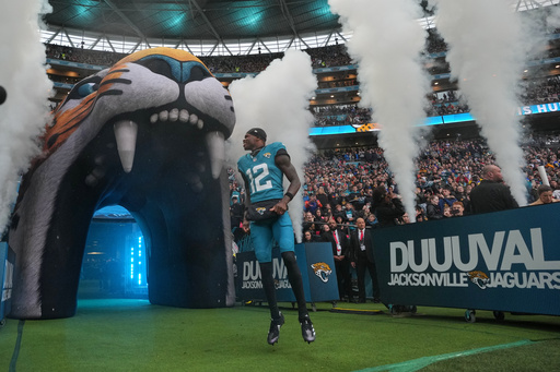 Jacksonville Jaguars wide receiver Travis Hunter (12) runs onto the field for an NFL football game between the Los Angeles Rams and the Jacksonville Jaguars in London, Sunday, Oct. 19, 2025. (AP Photo/Kin Cheung) Jacksonville Jaguars wide receiver Travis Hunter (12) runs onto the field for an NFL football game between the Los Angeles Rams and the Jacksonville Jaguars in London, Sunday, Oct. 19, 2025. (AP Photo/Kin Cheung)