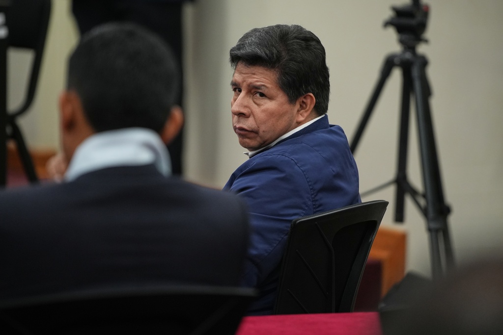 Former President Pedro Castillo, who faces charges of rebellion and other crimes against the state, attends his sentence hearing at a police base on the outskirts of Lima, Peru, Thursday, Nov. 27, 2025. (AP Photo/Guadalupe Pardo)