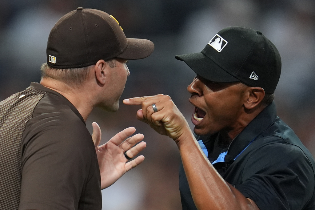 San Diego Padres manager Craig Stammen, left, argues with home plate umpire Jeremie Rehak. during the fourth inning of a baseball game against the Colorado Rockies Tuesday, July 28, 2026, in San Diego. (AP Photo/Gregory Bull)