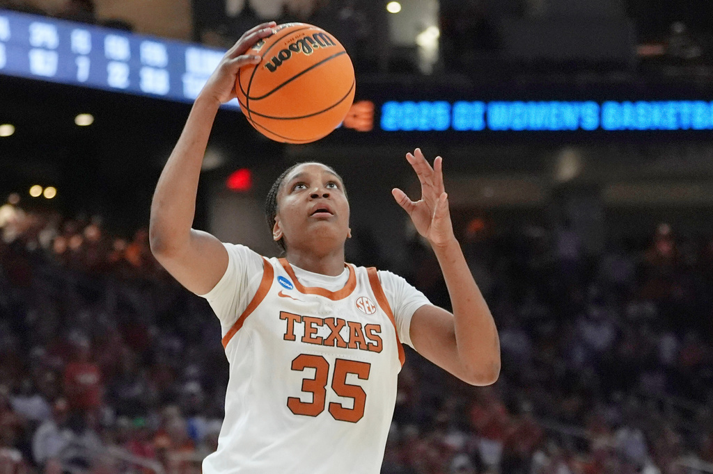 FILE - Texas forward Madison Booker (35) scores against Illinois during the second half in the second round of the NCAA college basketball tournament in Austin, Texas, Monday, March 24, 2025. (AP Photo/Eric Gay, File)