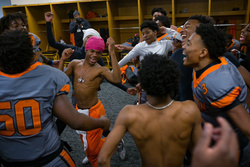 Clairton High School football players celebrate in the locker room after winning the WPIAL Championship at Acrisure Stadium in Pittsburgh, Pa., on Saturday, Nov. 22, 2025. (Quinn Glabicki/Pittsburgh's Public Source via AP)