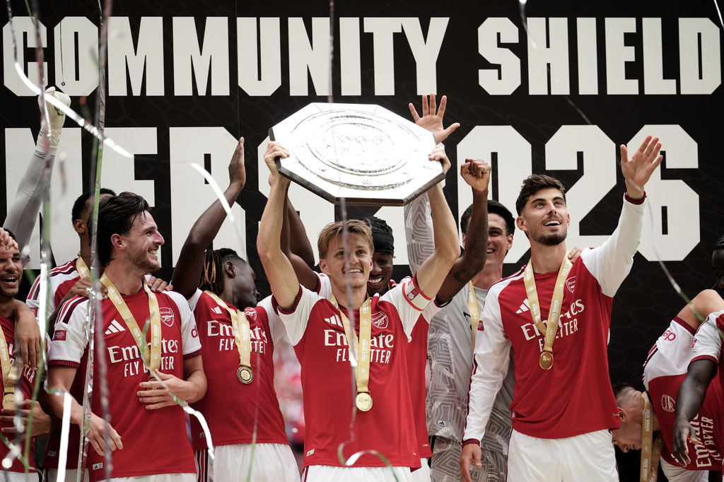 Arsenal's Martin Odegaard lifts the trophy after his team won the FA Community Shield final soccer match between Arsenal and Manchester City in Cardiff, Wales, Sunday, Aug.16, 2026. (AP Photo/Alastair Grant)