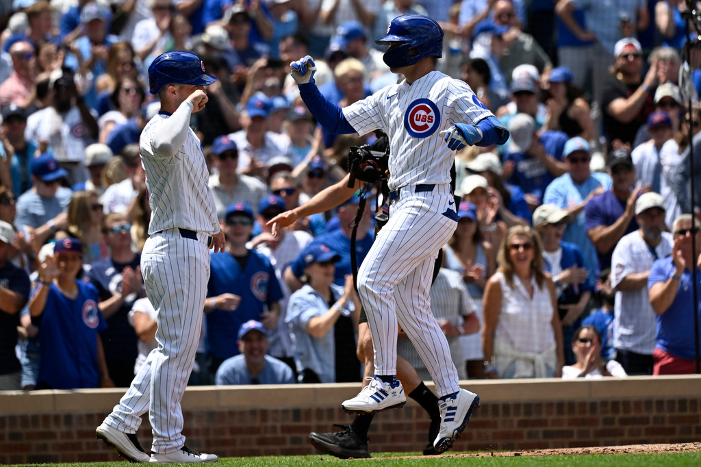 Chicago Cubs' Matt Shaw, right, high-fives Alex Bregman after Shaw's three-run home run during the second inning of a baseball game against the Toronto Blue Jays, Saturday, June 20, 2026, in Chicago. (AP Photo/Matt Marton)