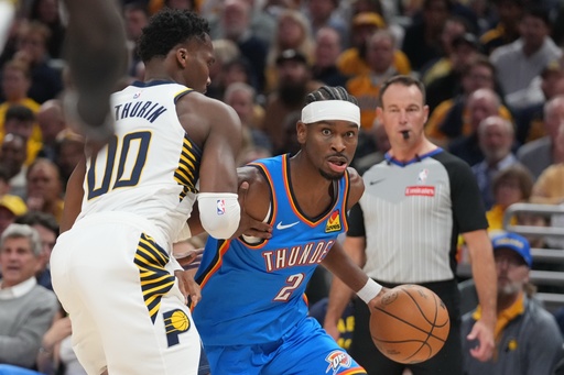 Oklahoma City Thunder's Shai Gilgeous-Alexander (2) is defended by Indiana Pacers' Bennedict Mathurin (00) during the first half of an NBA basketball game, Thursday, Oct. 23, 2025, in Indianapolis. (AP Photo/Darron Cummings) Oklahoma City Thunder's Shai Gilgeous-Alexander (2) is defended by Indiana Pacers' Bennedict Mathurin (00) during the first half of an NBA basketball game, Thursday, Oct. 23, 2025, in Indianapolis. (AP Photo/Darron Cummings)