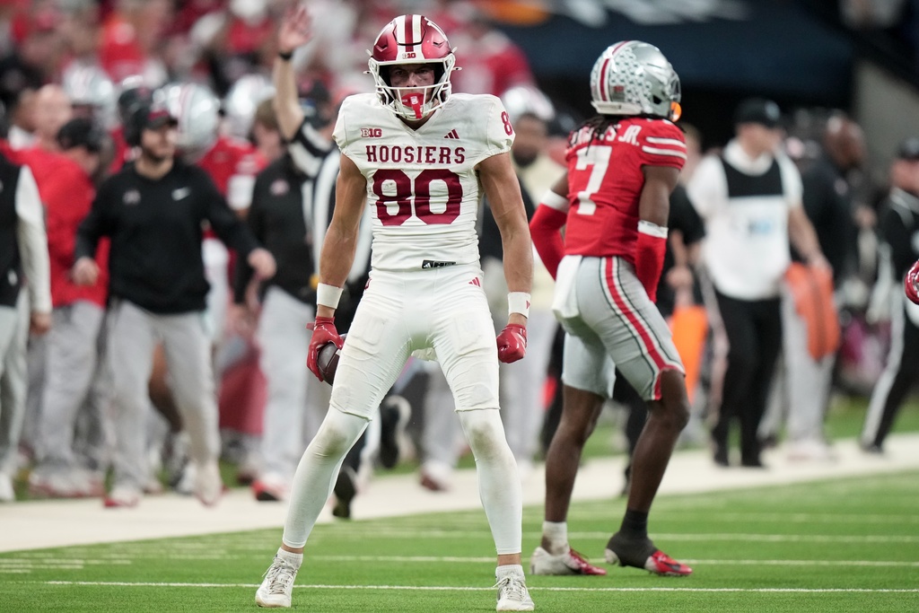 Indiana's Charlie Becker reacts after catching a pass for a first down during the second half of the Big Ten championship NCAA college football game against Ohio State in Indianapolis, Saturday, Dec. 6, 2025. (AP Photo/AJ Mast)