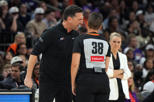 Phoenix Mercury head coach Nate Tibbetts, left, yells at official Lamont Simpson (38) after a foul during the second half of Game 4 of the WNBA basketball finals against the Las Vegas Aces, Friday, Oct. 10, 2025, in Phoenix. (AP Photo/Rick Scuteri) Phoenix Mercury head coach Nate Tibbetts, left, yells at official Lamont Simpson (38) after a foul during the second half of Game 4 of the WNBA basketball finals against the Las Vegas Aces, Friday, Oct. 10, 2025, in Phoenix. (AP Photo/Rick Scuteri)