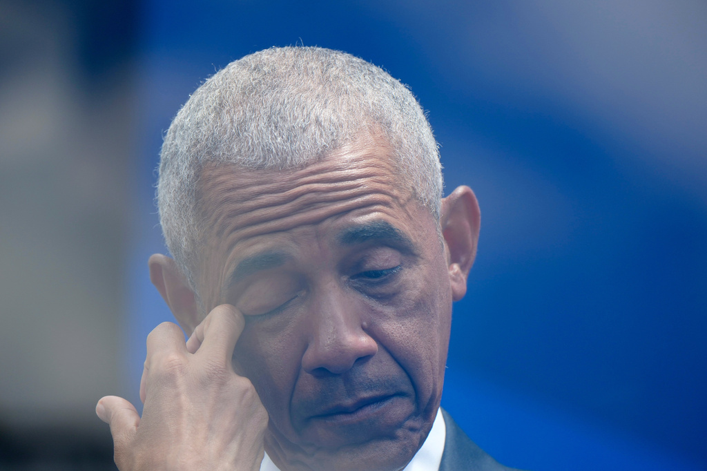 Former President Barack Obama reacts to remarks by former first lady Michelle Obama during the dedication ceremony for the Obama Presidential Center, Thursday, June 18, 2026, in Chicago. (AP Photo/Alex Brandon)