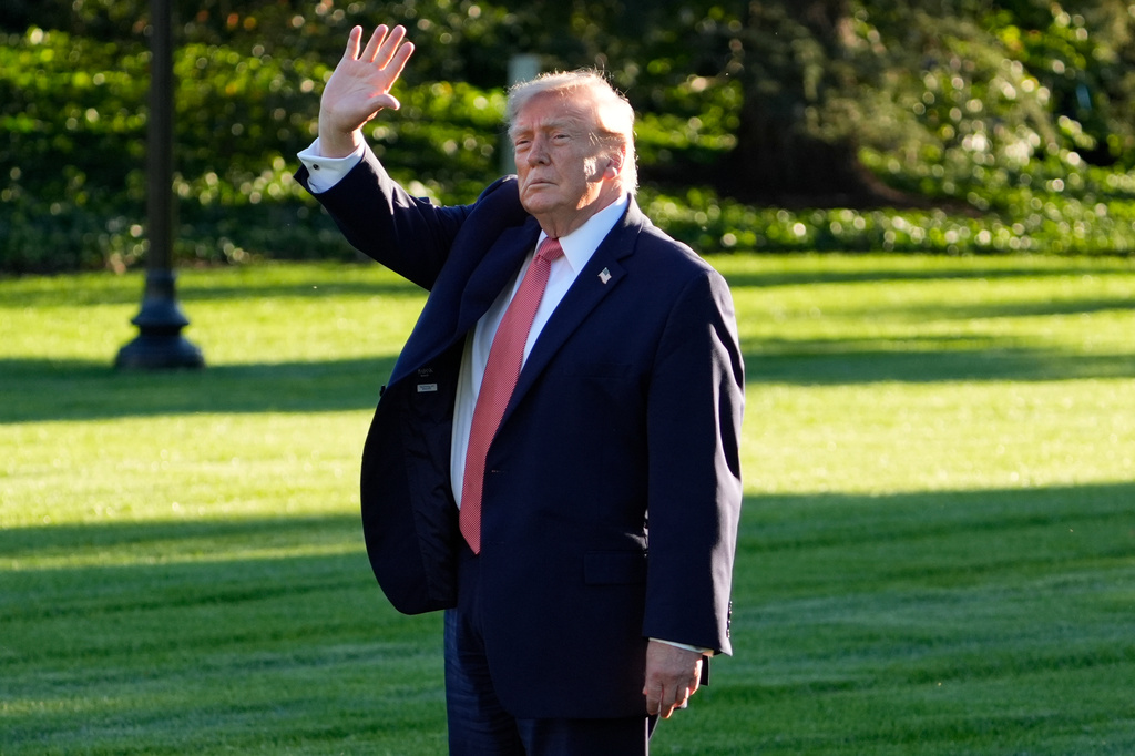 President Donald Trump waves as he walks to depart on Marine One from the South Lawn of the White House, Tuesday, Oct. 20, 2026, in Washington. (AP Photo/Manuel Balce Ceneta)