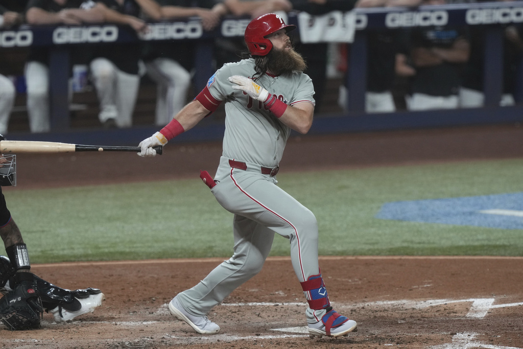 Philadelphia Phillies' Brandon Marsh hits a two-run home run during the fourth inning of a baseball game against the Miami Marlins Friday, Sept. 5, 2025, in Miami. (AP Photo/Marta Lavandier)